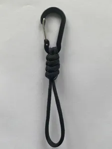 Black paracord lanyard with metal carabiner, durable outdoor accessory for bags and keys.