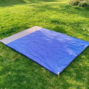 Waterproof outdoor camping picnic mat, portable foldable beach blanket with yellow ground stakes.