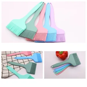 Silicone basting brush detail view, flexible pastel kitchen tool for baking and barbecue cooking.