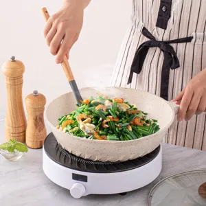 Non-stick frying pan with wooden handle silicone spatula kitchenware cooking detail image