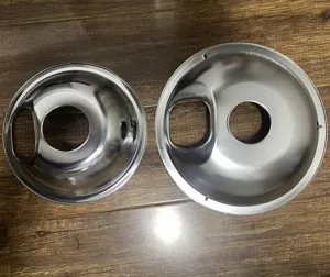 Detail view of stainless steel gas stove burner drip pan replacement parts set kitchen.