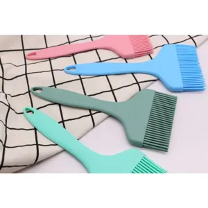 Set of four colorful wide silicone pastry and basting brushes for barbecue and baking.