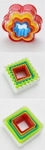 Detailed view of nested plastic cookie cutter sets, colorful baking molds for kitchen pastry.