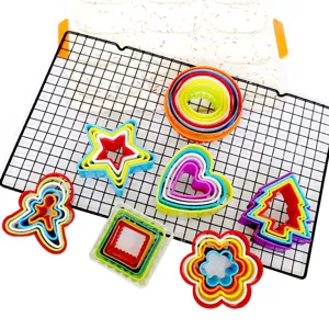 Colorful nested cookie cutters set, plastic baking molds for biscuits, fruit, and fondant.