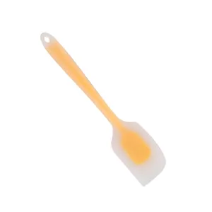 Large translucent silicone spatula for cake baking, butter scraping and kitchen stirring use.