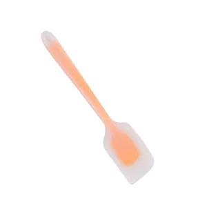Close-up detail of the translucent silicone baking spatula handle and flexible scraper head.