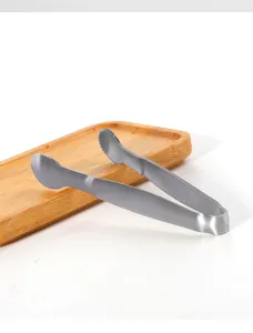 Stainless steel ice tong detail, durable metal sugar tong for kitchen and bar use.