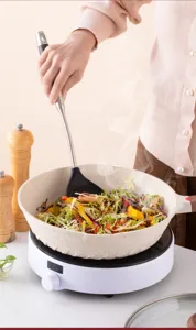 Stainless steel silicone kitchen cooking spatula, heat-resistant non-stick pan turner tool.