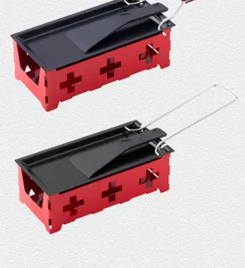 Mini raclette grill detail, red metal base with cross cutouts, black non-stick pan.