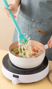 Teal speckled silicone pasta server with ergonomic handle for daily kitchen cooking use.