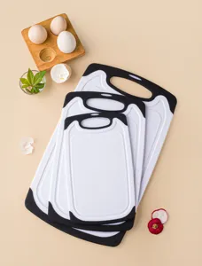 Detailed close-up shot of nested plastic cutting boards in a kitchen scene setup.