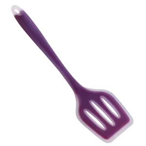Silicone slotted spatula detail, flexible nonstick cookware tool with comfortable grip handle.