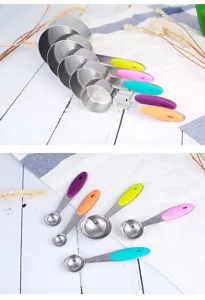 Stainless steel measuring cups and spoons set with colorful handles, baking kitchen tools.