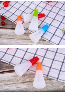 Silicone oil bottle brush detail showing translucent container and colorful bristles.