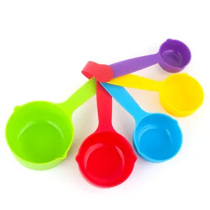 Colorful plastic measuring cups set for baking and cooking kitchen tools essential main view