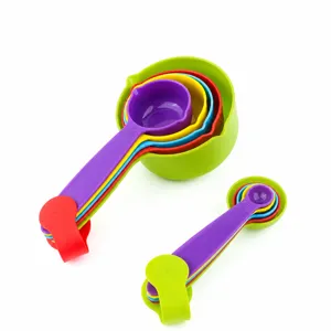 Colorful plastic measuring spoons and cups set for kitchen baking and cooking use.