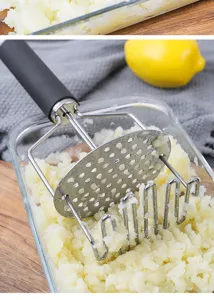 Stainless steel double-layer potato masher detail, ergonomic handle for kitchen cooking.