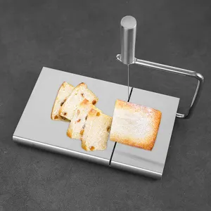 Stainless steel cheese slicer with wire cutter for butter, cake, and kitchen food prep.