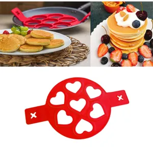 Red 7-hole silicone heart pancake mold kitchen baking tool for easy DIY breakfast eggs.