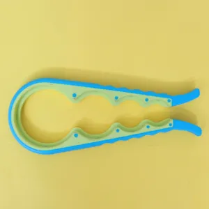 Multifunctional 4-in-1 bottle opener, anti-slip jar opener kitchen tool for various caps.