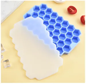 Blue honeycomb silicone ice cube tray with lid, 37 grids flexible mold for DIY summer cooling drinks.