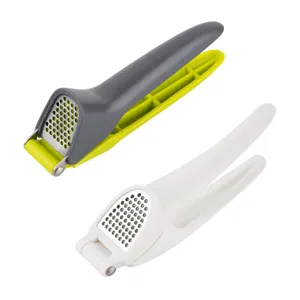 Ergonomic plastic garlic press with stainless steel mesh grid, dual color manual mincer tool for kitchen.