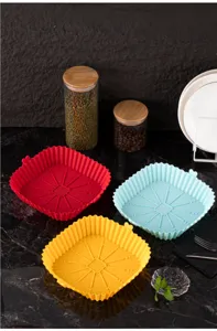 Square silicone air fryer liner detail displaying heat resistant material and surface texture.