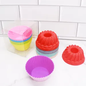 Set of colorful silicone muffin cups and mini bundt cake molds for baking delicious treats.