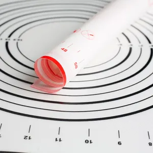 Large non-stick silicone pastry mat with measurement scales for baking and dough rolling.