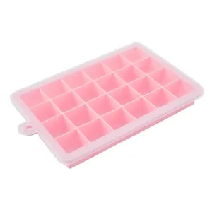 Silicone ice cube tray detail view, flexible pink ice grid with clear lid and hanging hole.