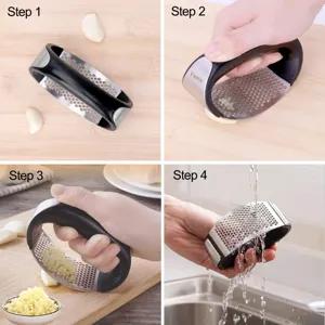 Stainless steel manual curved garlic press, kitchen garlic mincer tool with ergonomic handle.
