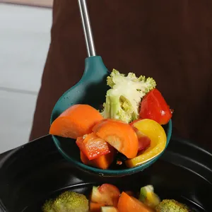 Green silicone soup ladle featuring a stainless steel handle for home kitchen cooking