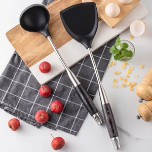 Stainless steel silicone kitchen spatula and soup ladle set, heat-resistant cooking tool.