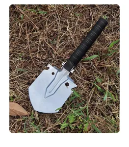 Portable folding camping shovel with serrated edge and multi-function tool holes for outdoor use.