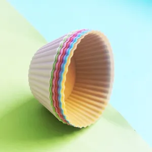 Silicone muffin baking cups detail, colorful reusable cupcake molds for kitchen home baking.