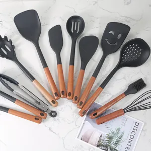 Silicone kitchen utensils set with wooden handles, heat-resistant spatula and soup spoon.
