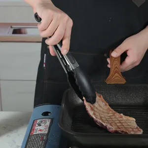 Heat resistant silicone kitchen tongs and spatula set for cooking nonstick cookware.