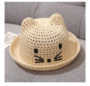 Kids cute cat ear straw sun hat detail, summer baby beach woven cap, cute design.