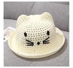 Cute baby sun hat with cat ears and embroidered face, breathable knitted summer hat for young kids.