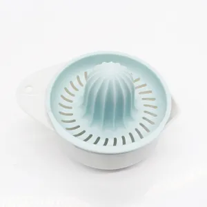 Manual citrus juicer detail view, plastic lemon squeezer with strainer for fresh fruit juice.