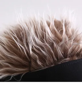 Close-up detail of spiky wig baseball cap, fun hair hat showing textured synthetic hair.