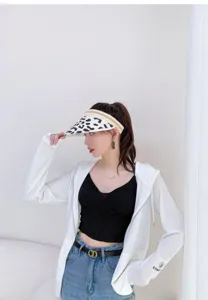 Cow print sun visor hat, summer open top straw hat detail view, stylish and breathable outdoor shade.