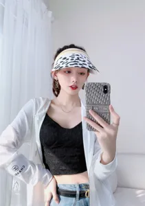 Stylish cow print empty top sun hat for women, perfect summer outdoor beach visor cap.
