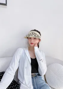 Summer empty top sun hat detail view, stylish straw visor and casual outfit showcasing design.