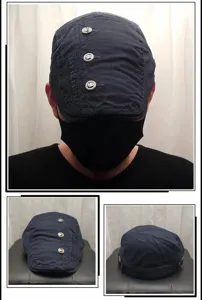 Detailed view of the retro navy blue flat cap with metal buttons and side embroidery.