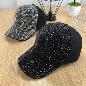 Detailed view of sparkly rhinestone baseball cap for women, stylish sun protection hat.