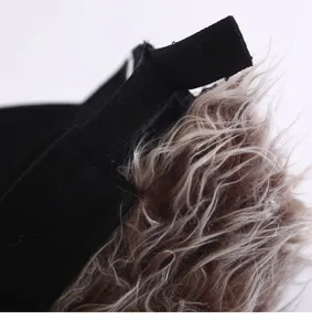 Detail view of the funny spiky wig baseball cap, showing adjustable strap and synthetic hair.