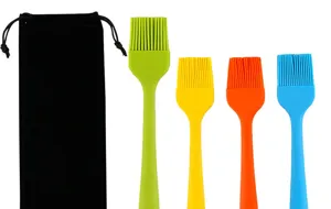 Silicone basting brush set detail view showing four colorful silicone pastry brushes and bag.