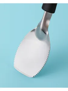 Stainless steel ice cream shovel detail view, serrated edge design with black handle.