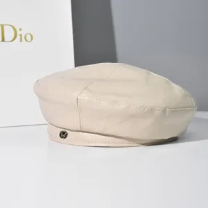 Chic beige PU leather beret hat for women and men, stylish retro autumn winter accessory.